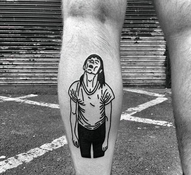 腿部一位已颓废的男士纹身图案