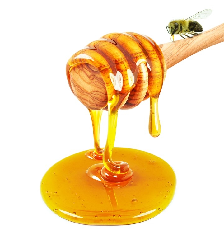 美味的蜂蜜与蜂蜜棒高清图