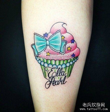 纹身520图库发布一幅小清新蛋糕蝴蝶结纹身图片