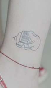 女性手臂卡通象刺青
